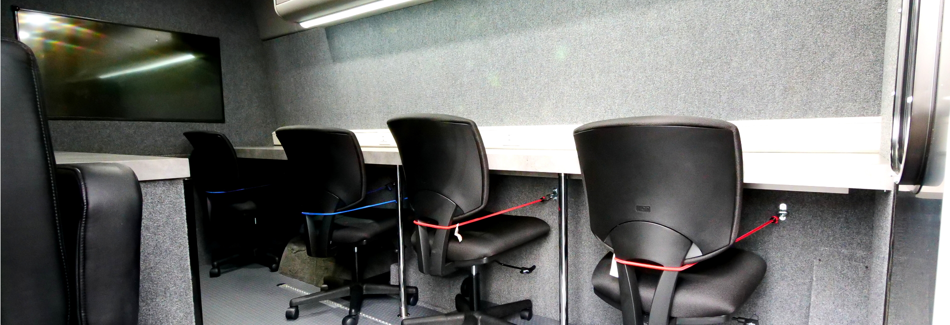 Onsite disaster assessment hub featuring 4-person workstation, overhead storage, retractable awning, and auxiliary tank.